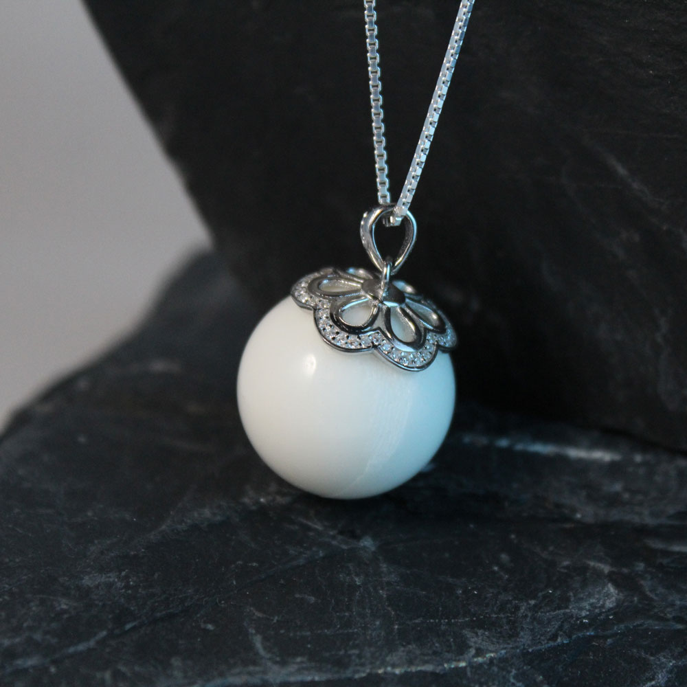 Muttermilchschmuck Perle mit Kristallkappe silber